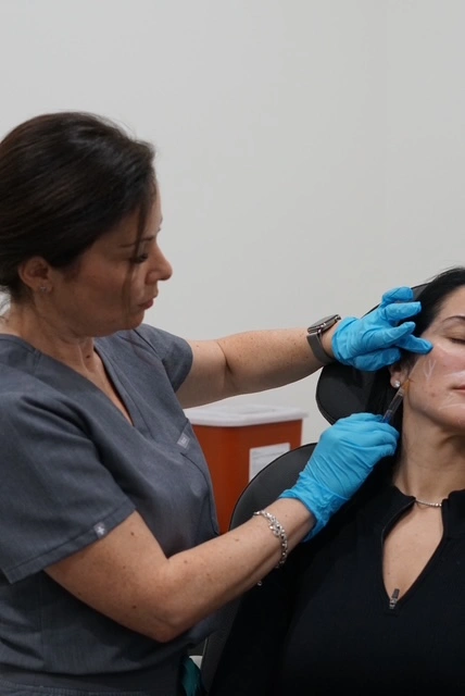 Botox neurotoxin injection into a patient's temple area at Better Me Medical Spa